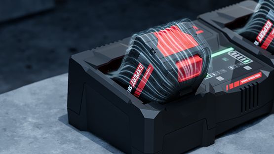 검은 충전기 위에 빨간색 Bosch Professional 배터리 두 개.